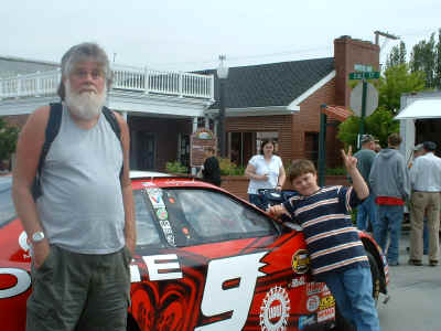 Curtis and Noah with Kasey Kahne's race car